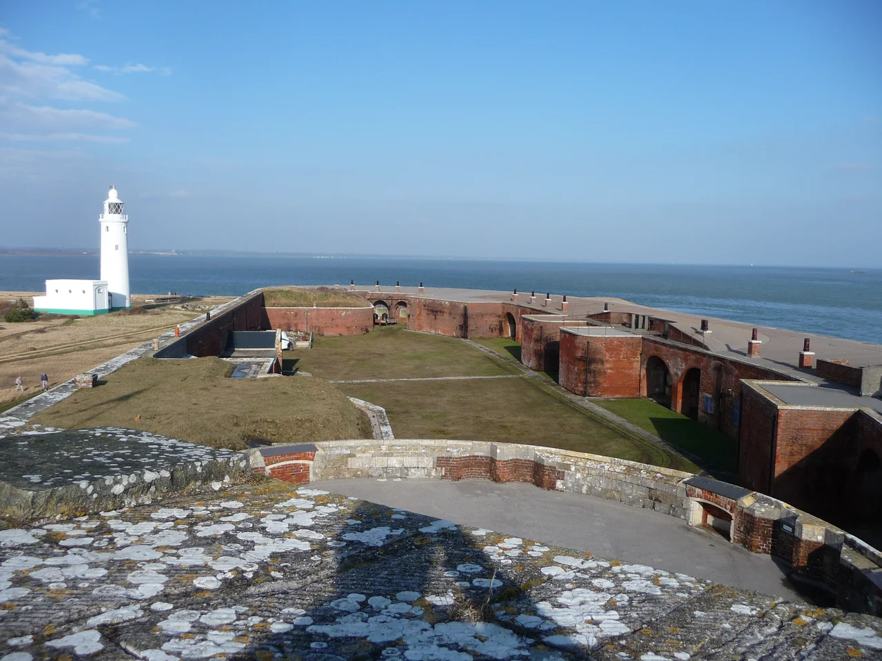 Hurst Castle : East Wing & Lighthouse Looking out across the eastern section of the castle and also the coastline can be seen in the distance across the Solent.
