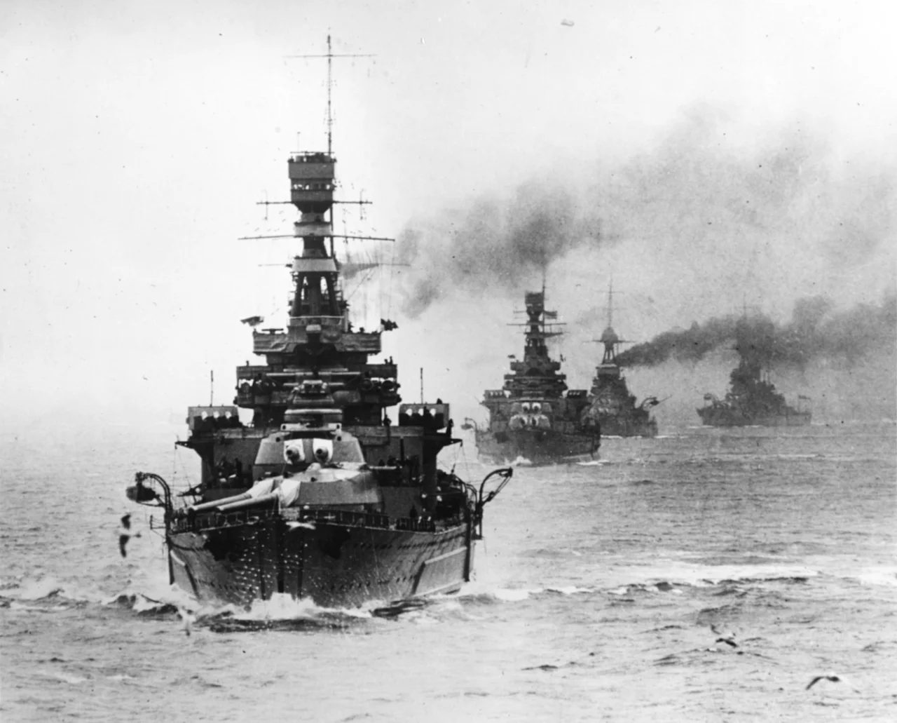 The battlecruiser HMS Repulse leading other Royal Navy capital ships during maneuvers, circa the late 1920s.
The next ship astern is HMS Renown. The extensive external side armor of Repulse and the larger "bulge" of Renown allow these ships to be readily differentiated.