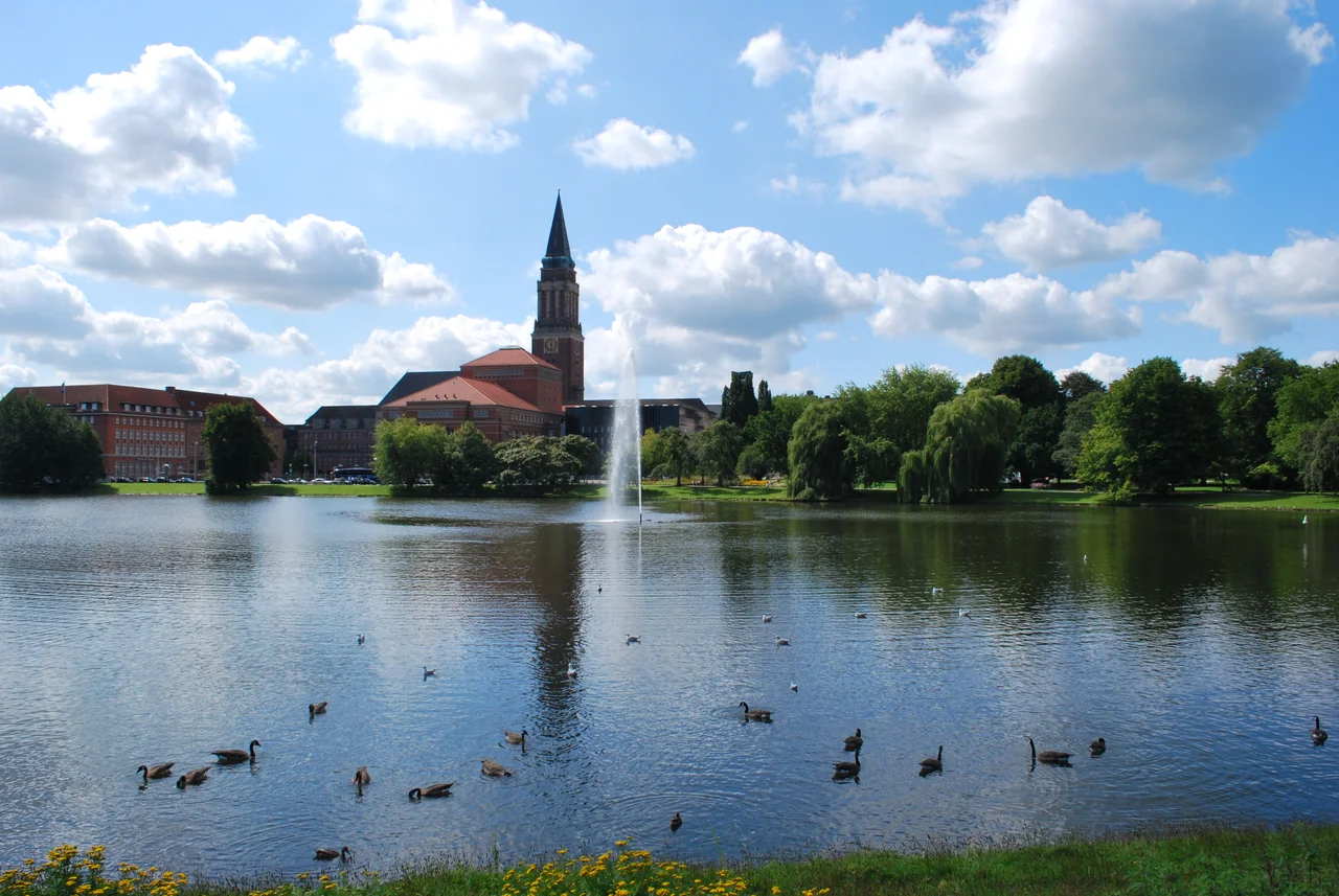 Western part of the lake Little Kiel in the city of Kiel. Tower of the Town hall (City hall) and the Opera House (front), Hiroshimapark in the background to the right.